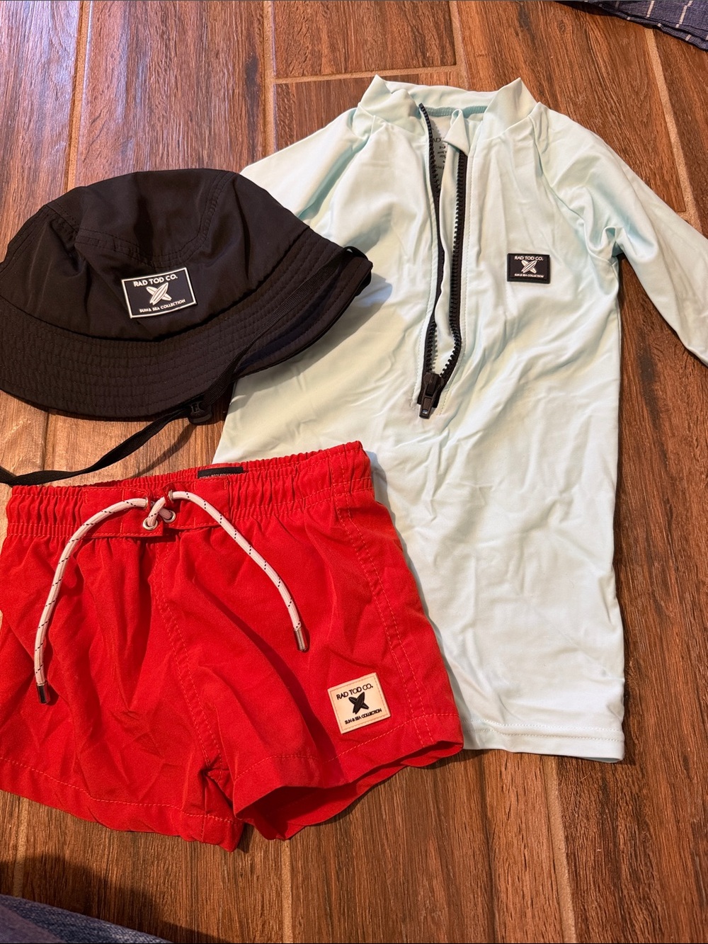 Rad Todd Co. Kids Swim Set - Mint Rash Guard, Red Swim Trunks, Black Bucket Hat